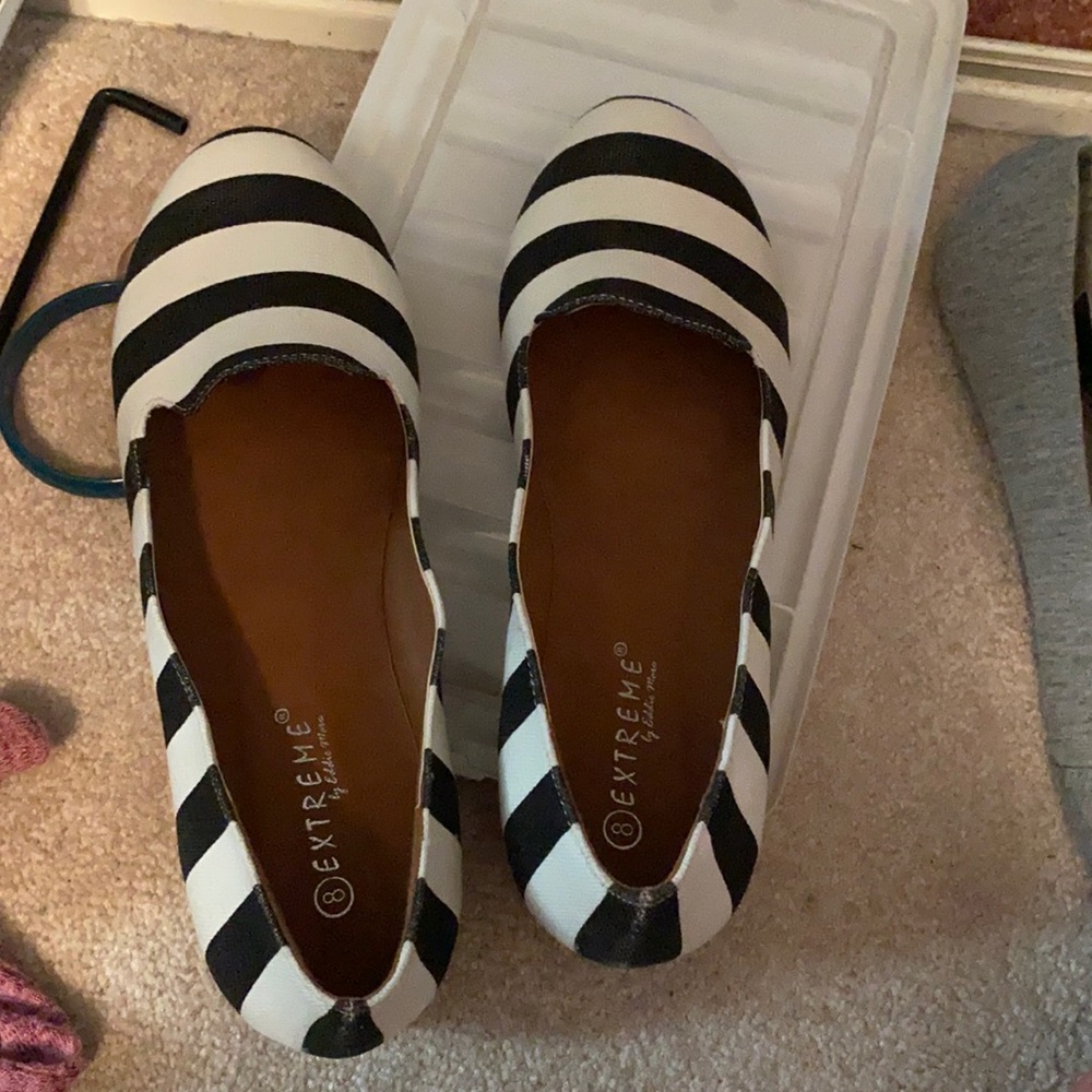 Women’s flat black and white striped
